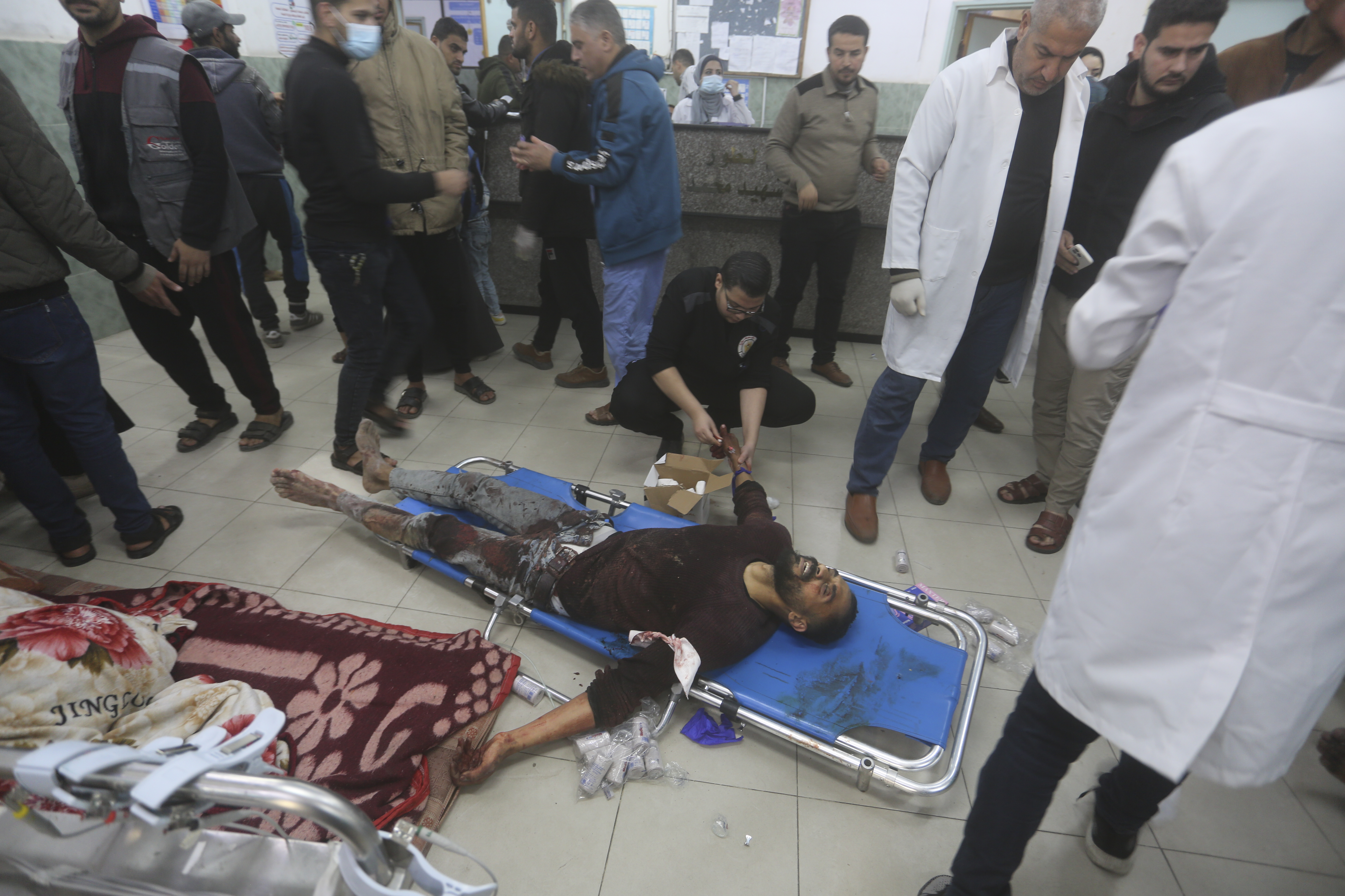 A Palestinian wounded in the Israeli bombardment of the Gaza Strip is treated at a hospital in Rafah on Tuesday, Jan. 16, 2024. (AP Photo/Hatem Ali)